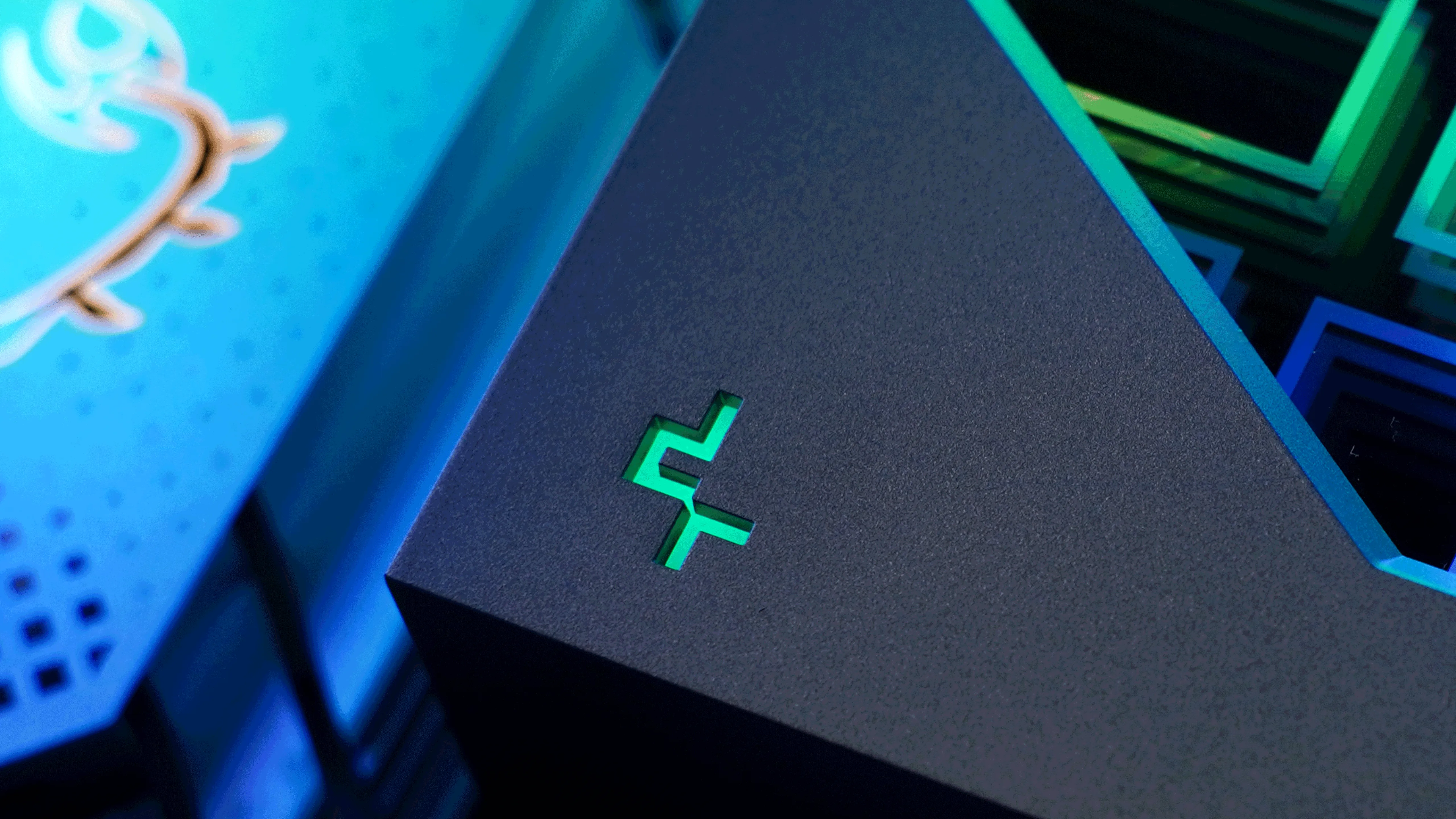 The DeepCool mark, lit through a corner of the cap