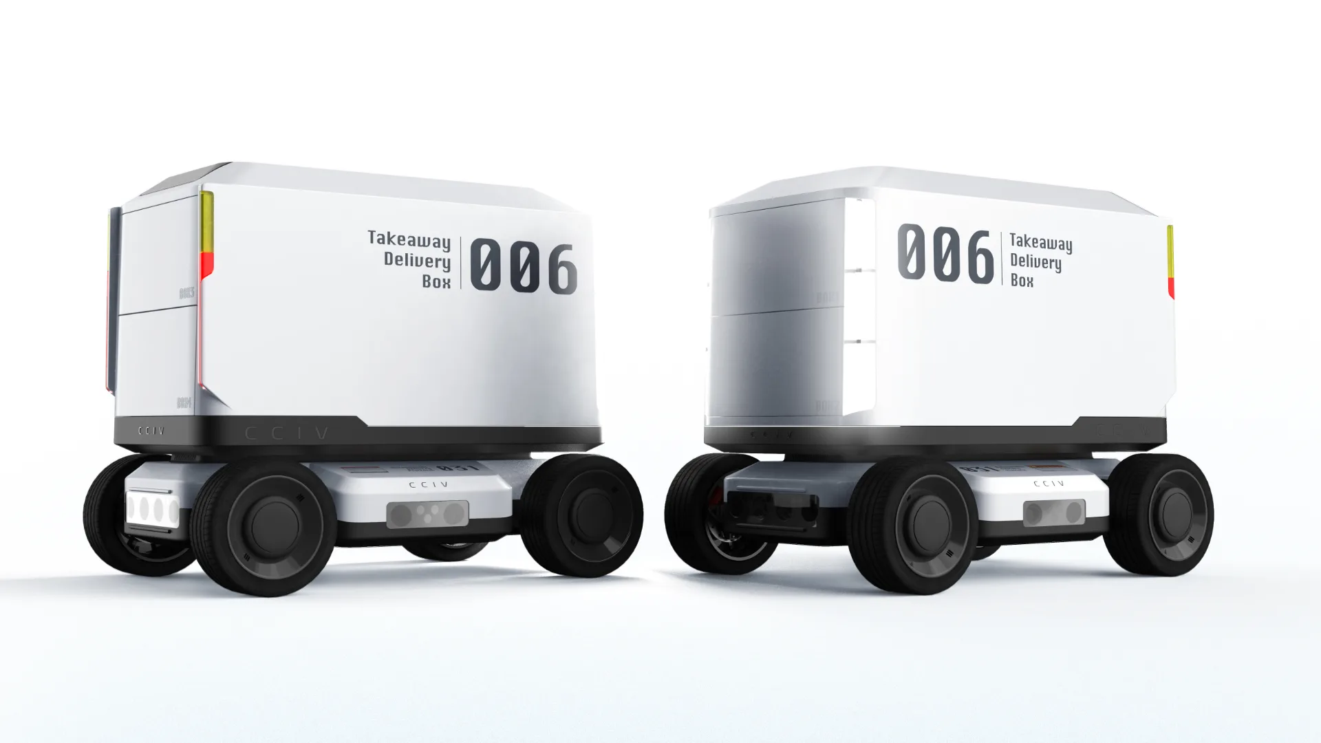 A pair on the production floor — same chassis, swappable cargo box.